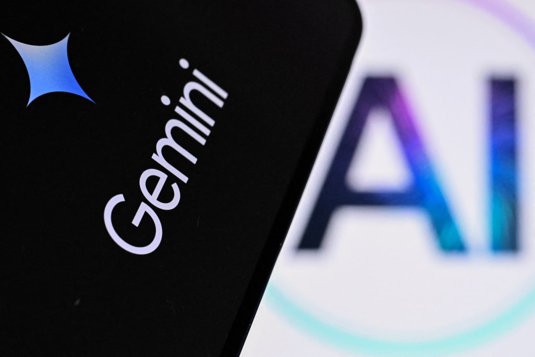 Laptop screen showing the letters AI beside the Google Gemini logo
